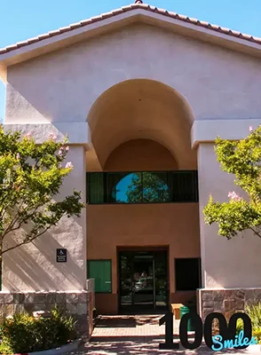 The exterior of the office building where 1000 Smiles Dental Group is located